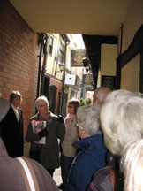Our guide tells us the history of Golden Cross Passage